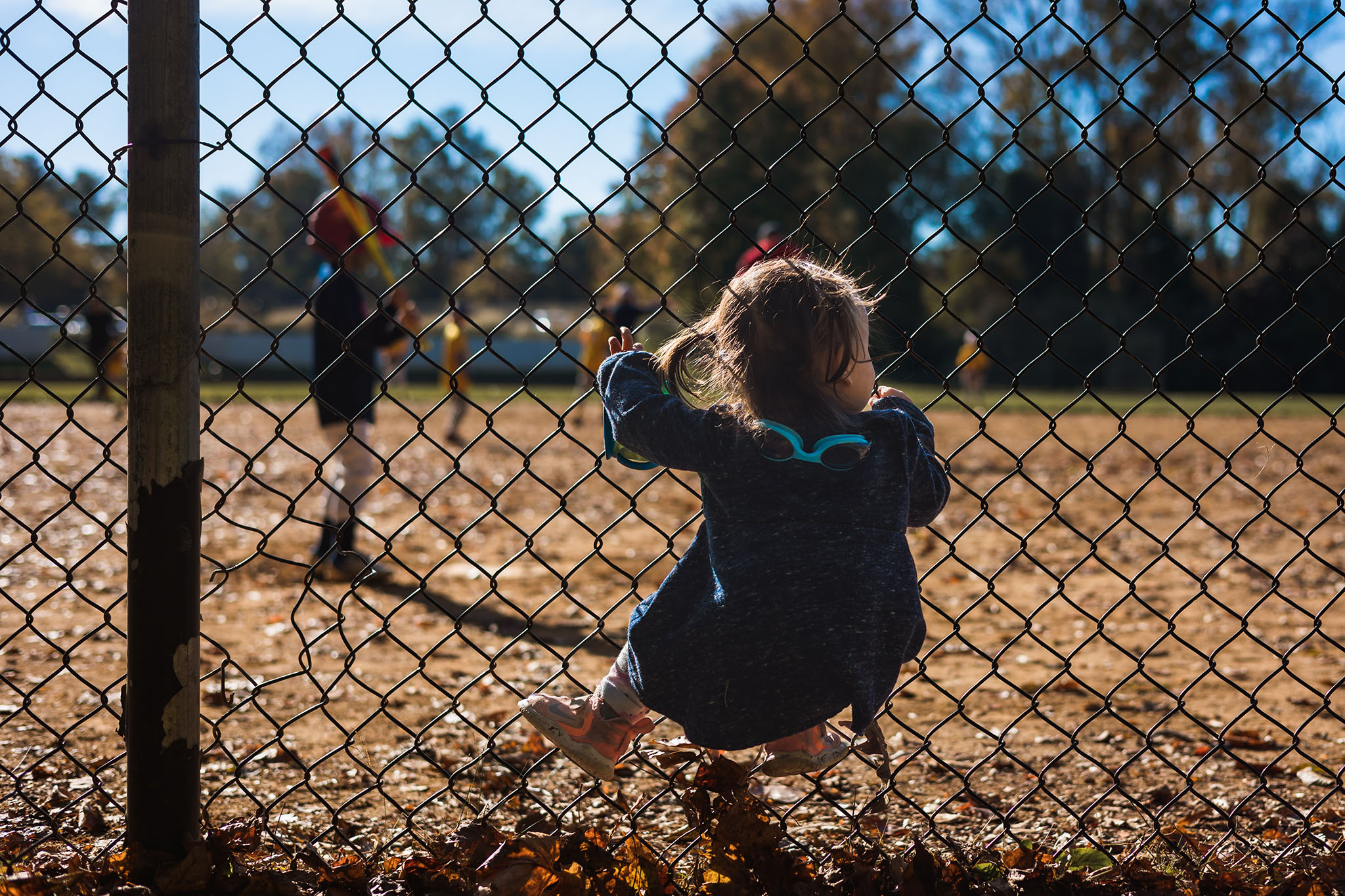 What Makes a Good Portfolio Image - Child on fence
