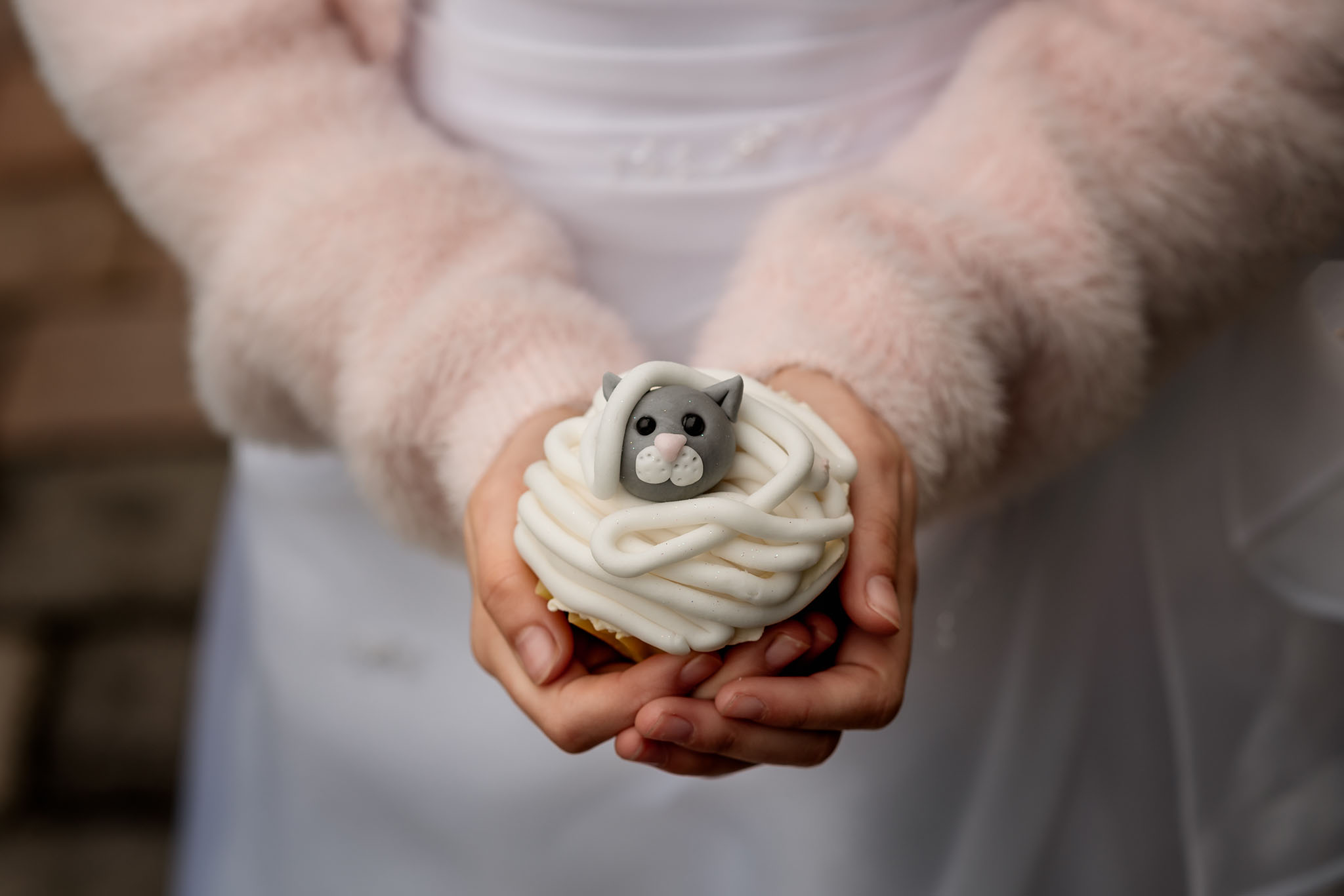Child holding cupcake