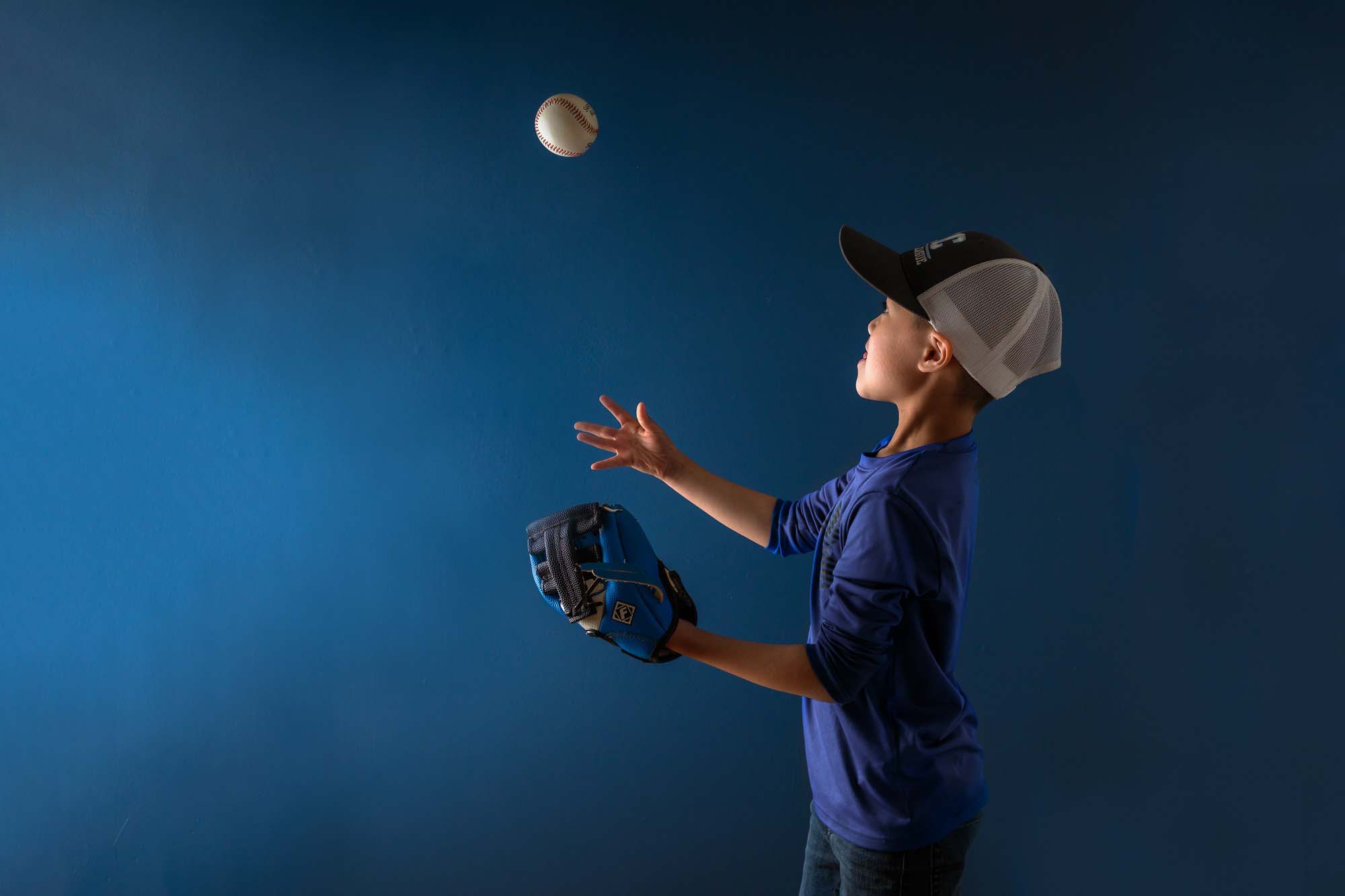 Photographing reluctant subjects - boy throwing baseball