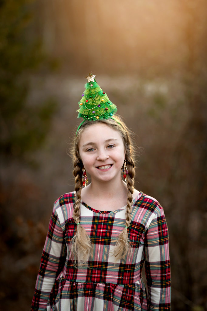 5 Holiday Photography Tips - girl with christmas tree on head