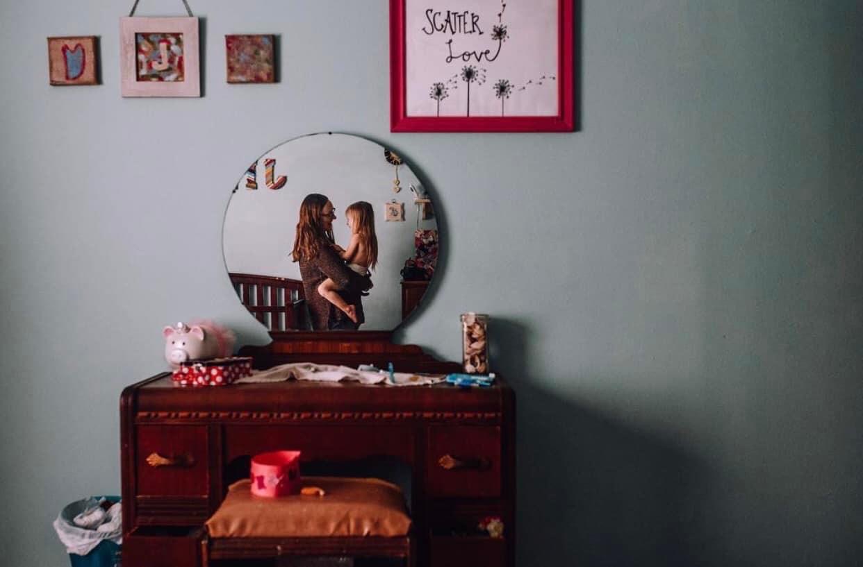 Images Re-Imagined - Mother holding daughter in a mirror