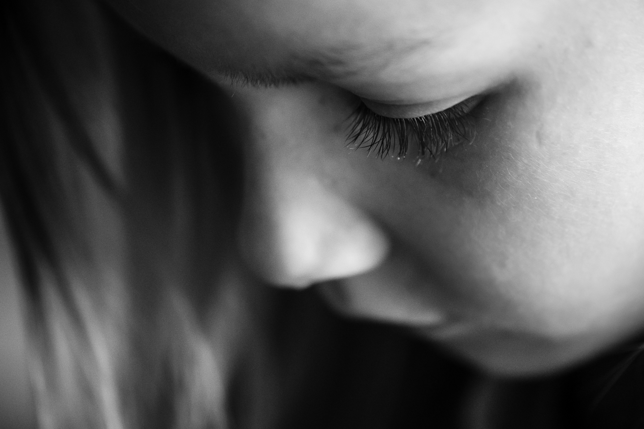 Close up of child's eye lashes in black and white