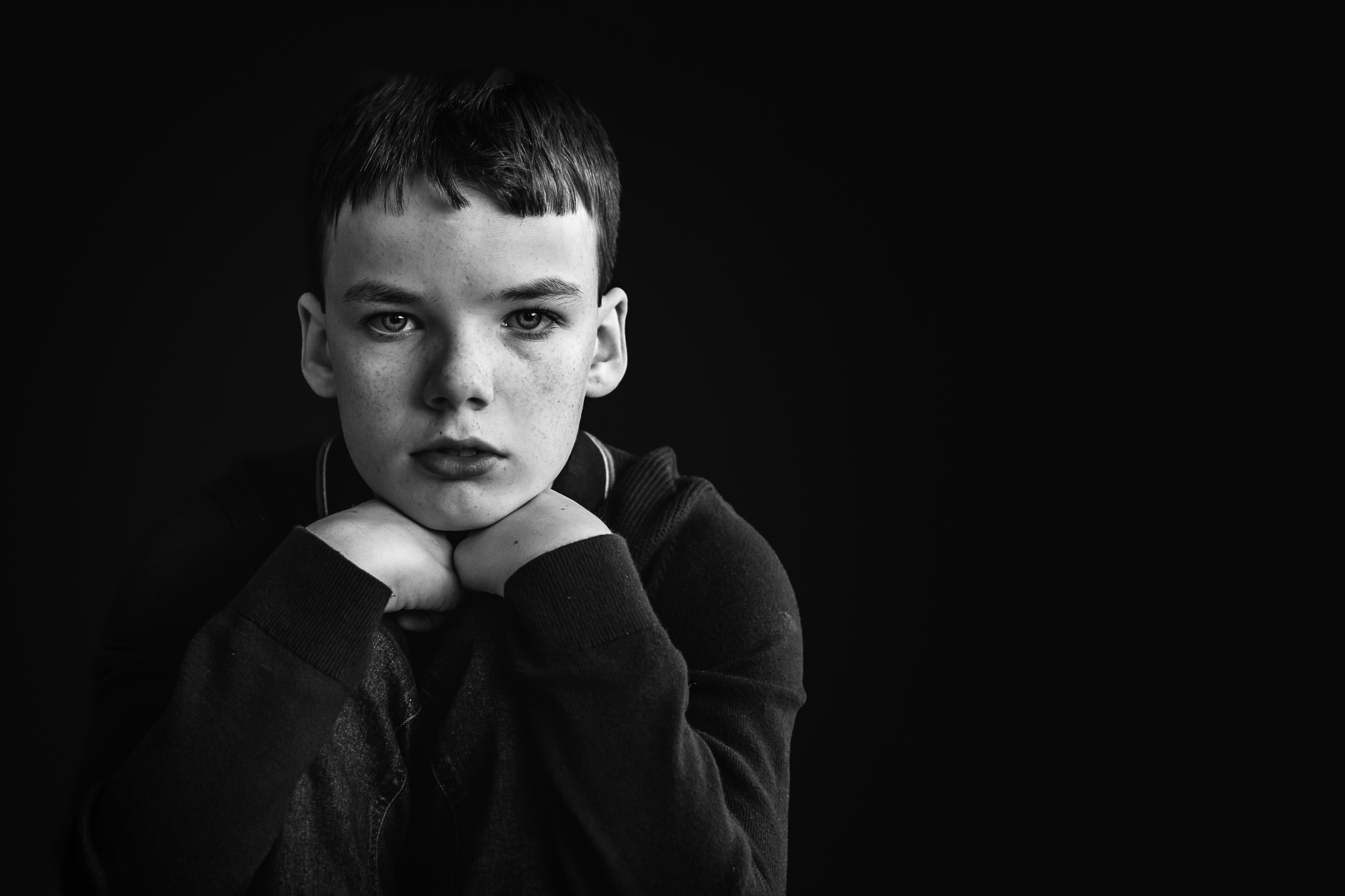 Black and white portrait of young boy