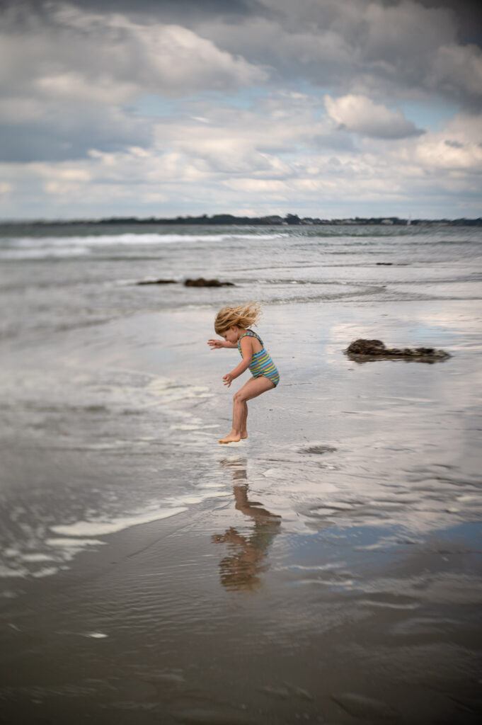 capturing action by freezing motion girl jumping on beach