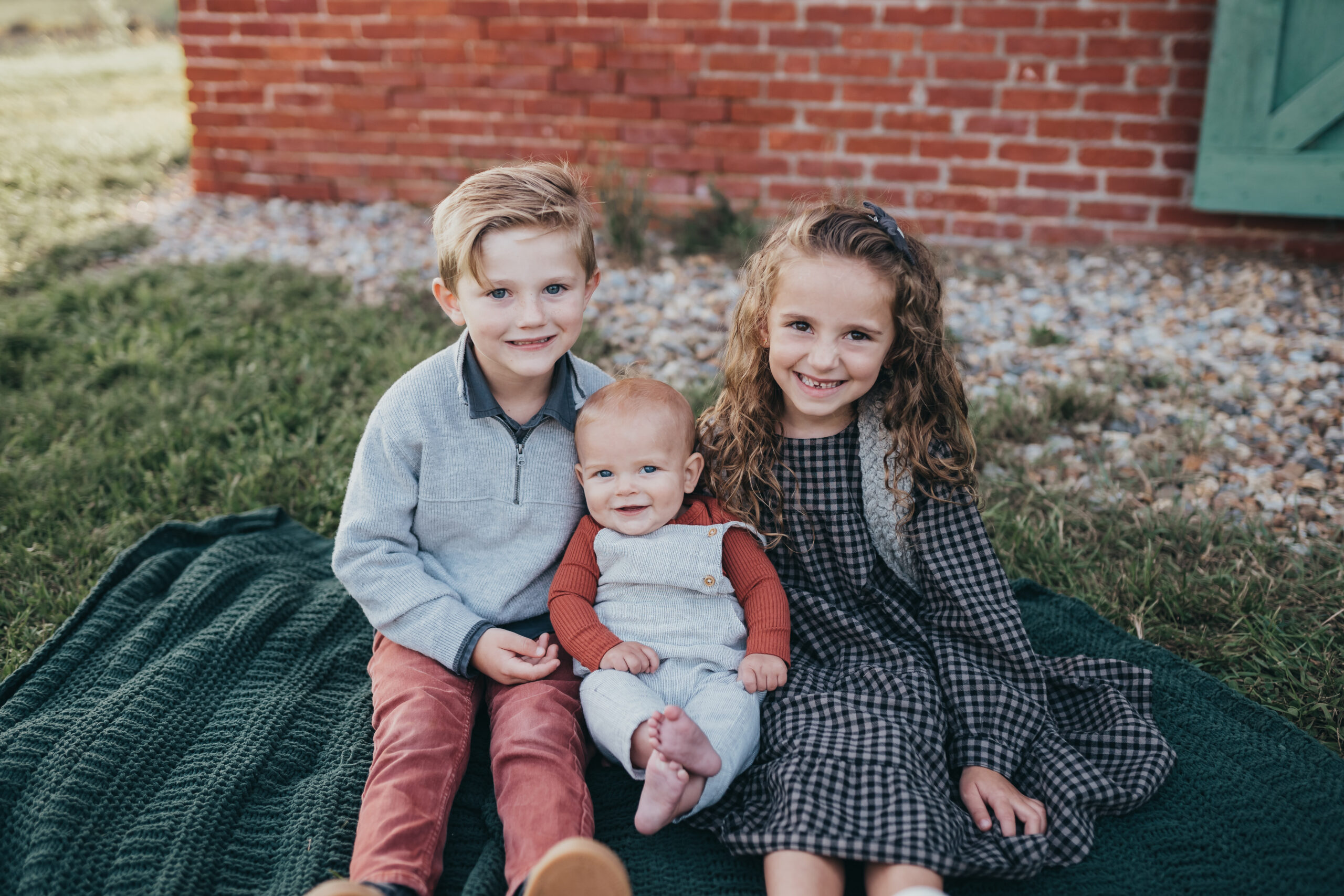 three children smiling during photo session