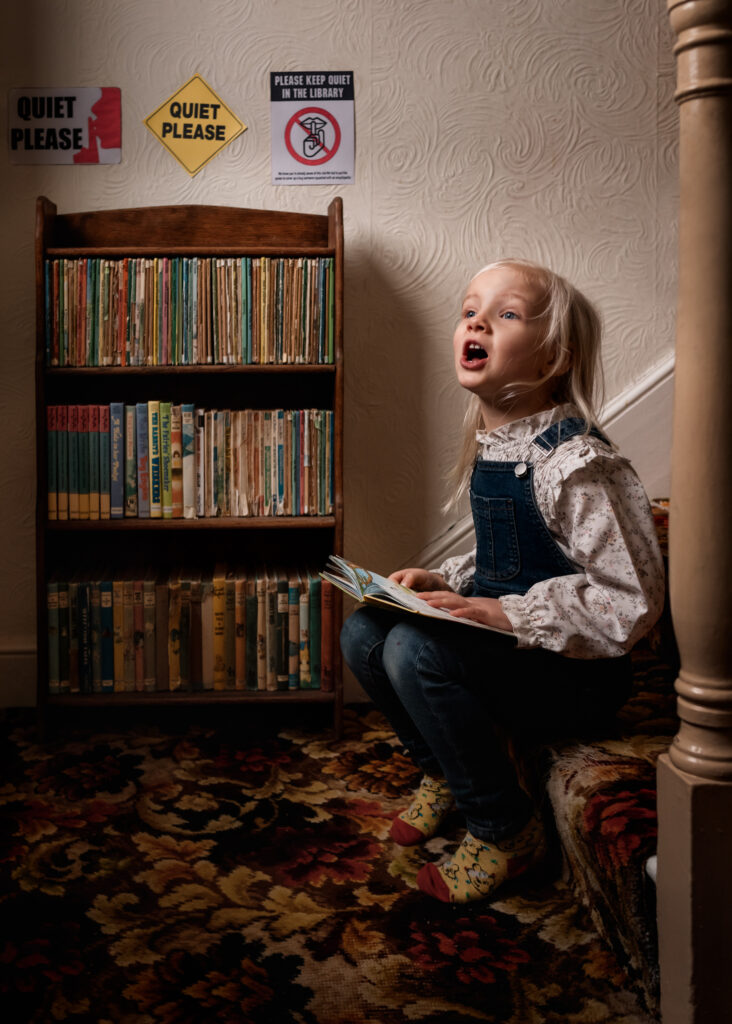 Little girl reading books