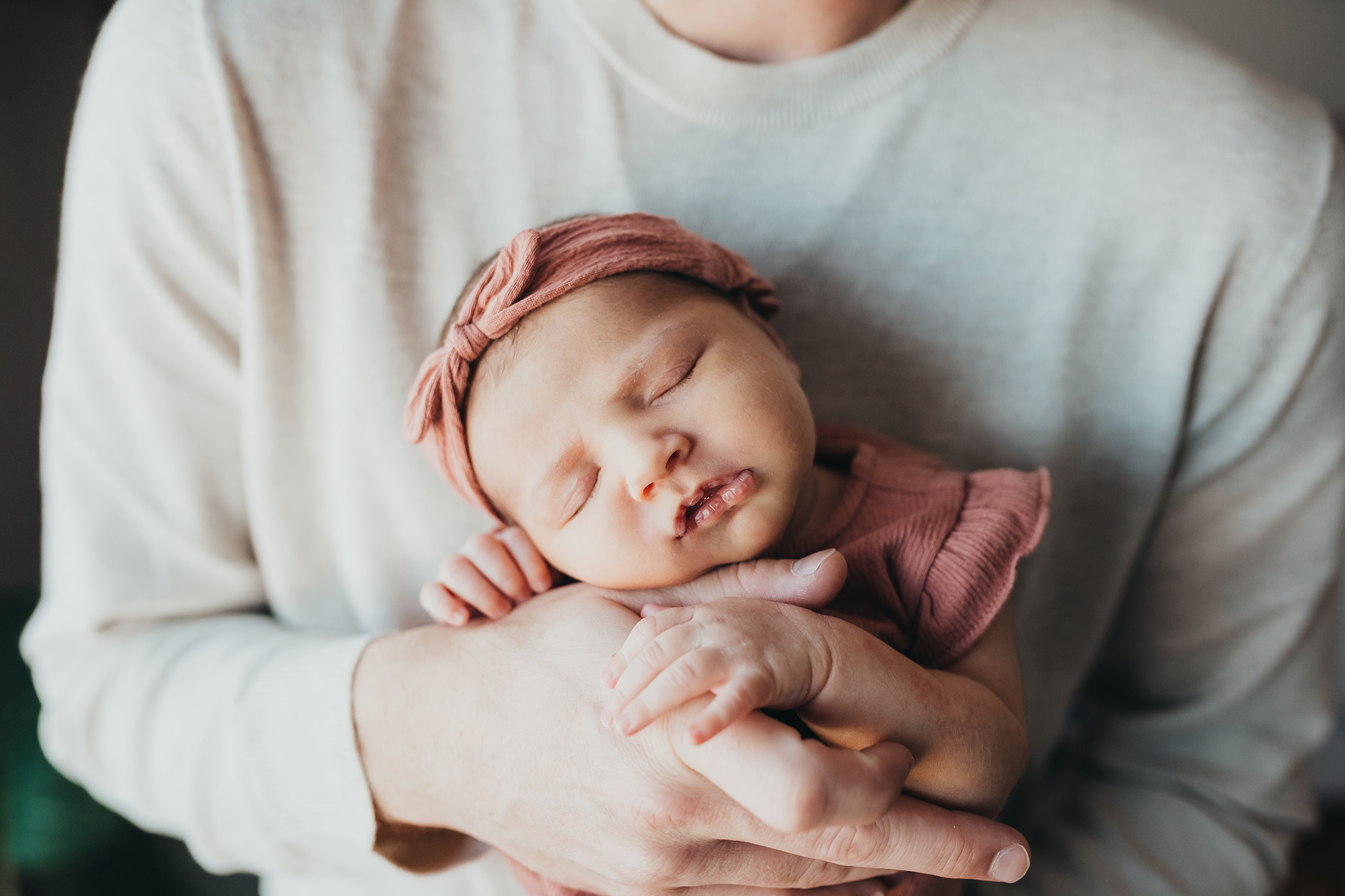 Newborn in dad's arms