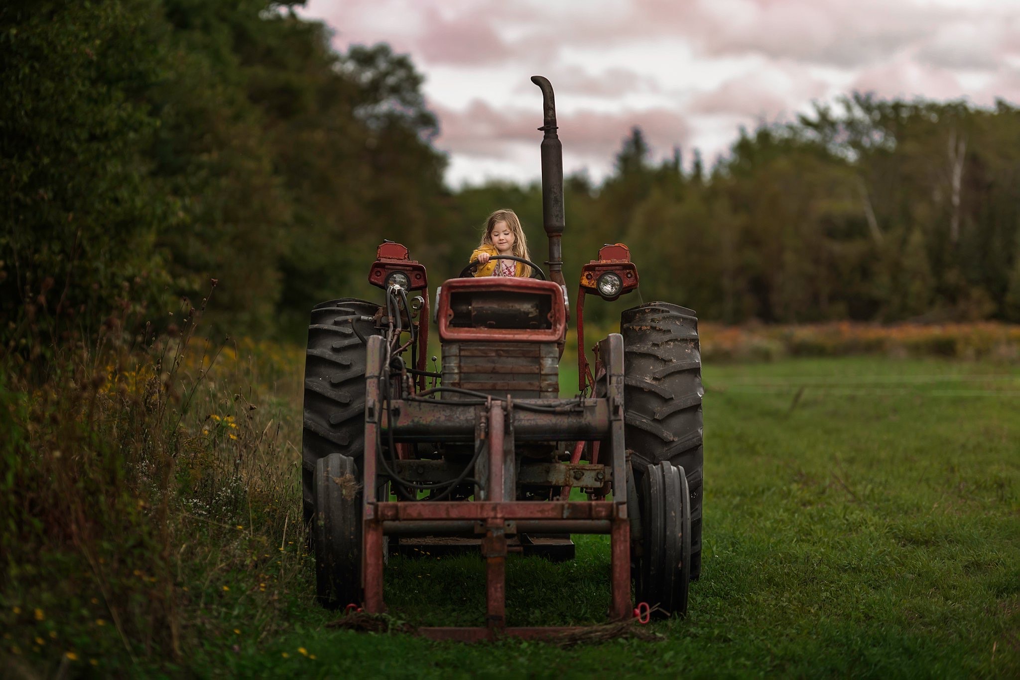 Creating a nostalgic childhood - girl on a tractor