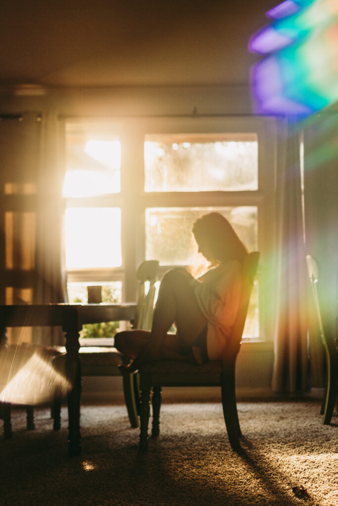 Girl in pretty light with rainbow flare